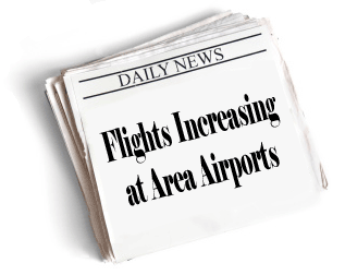 Newspaper headline: Flights Increasing at Area Airports